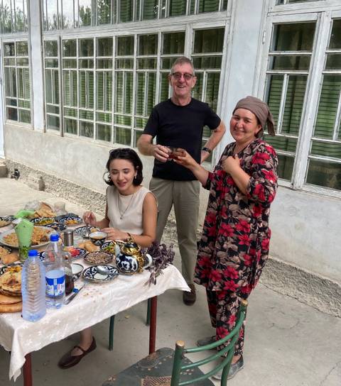 Group of people enjoying a meal outdoors.