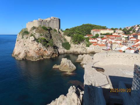 Scenic view of Dubrovnik fortress and coastline.