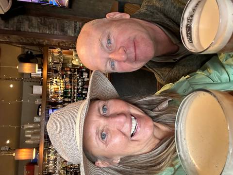 A couple enjoying drinks in a bar.