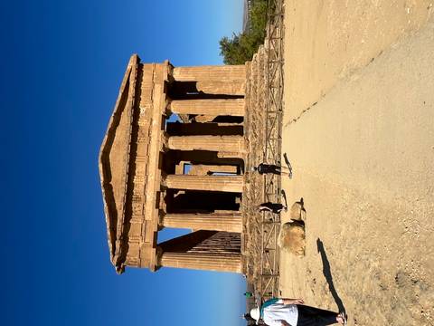 Historical temple ruins with visitors.