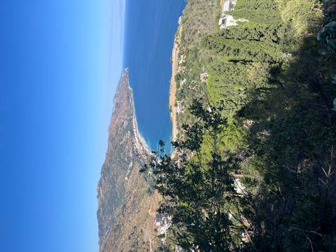 Scenic coastal view with mountains.