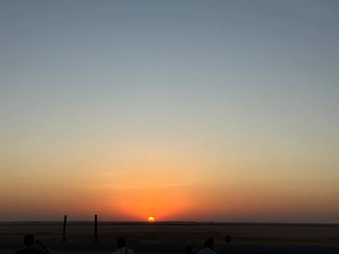 Minimalistic sunset with diminishing daylight over the horizon.