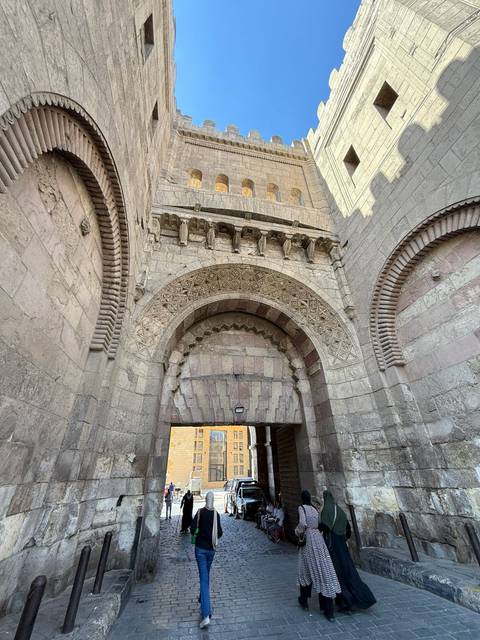 Historic arched entryway with detailed stonework.