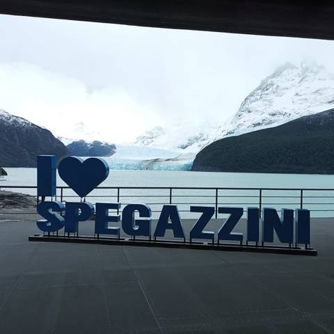 Scenic view of a glacier with a sign saying 'I Love Spegazzini'.