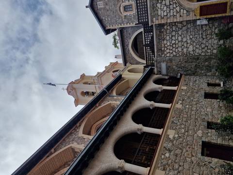 Monastery courtyard with stone arches.