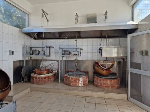 Industrial setup with drums and machinery.