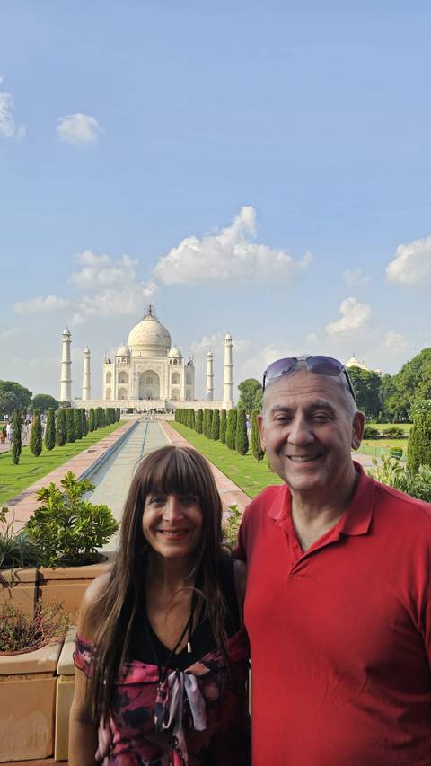 Tourists posing near the Taj Mahal in Agra.