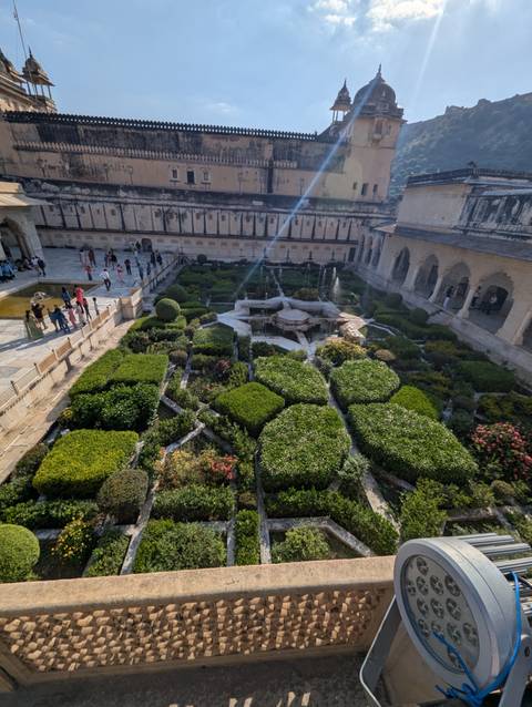 Gardens viewed from above in a historic site.