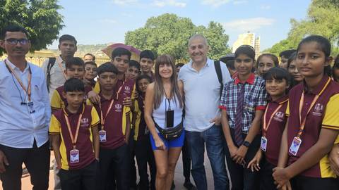 Group of people posing with students.