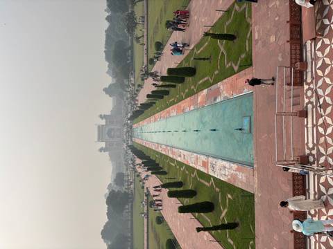 Reflective pool leading to a grand entrance.