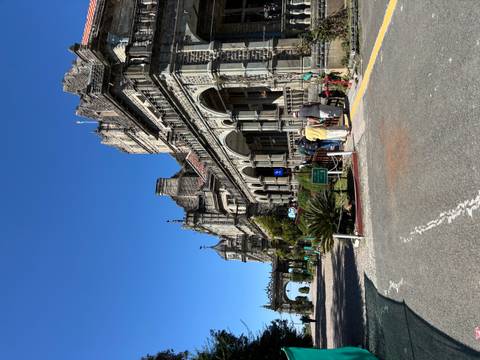 Historic building with ornate facade and clear sky.