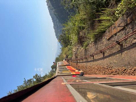 Train traveling through a landscape with scenic views.