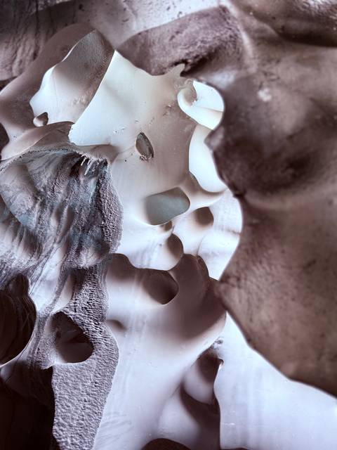 Close-up of an ice wall with interesting formations.