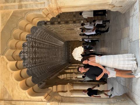 Couple inside a beautifully decorated corridor.