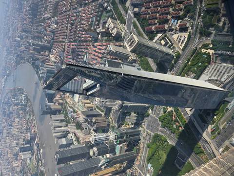 Aerial view of the Shanghai Tower in a cityscape.