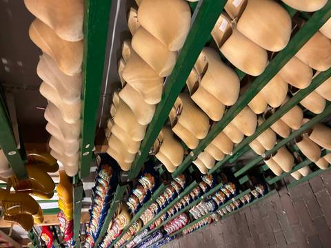 Shelves filled with traditional wooden clogs.