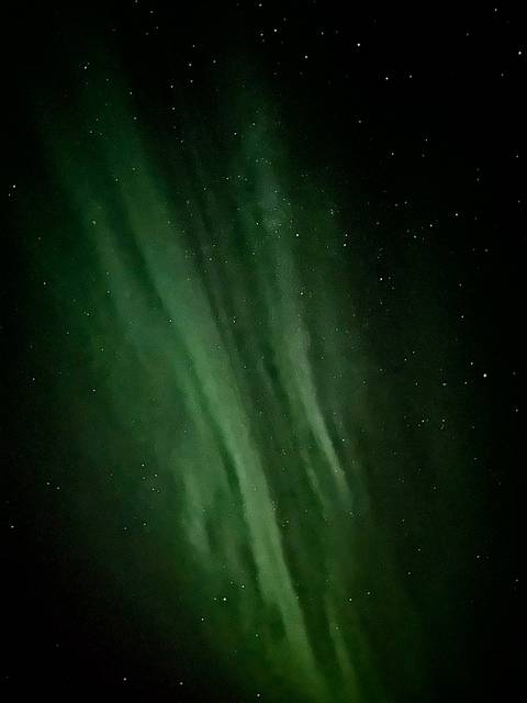 Northern lights with stars in the night sky.