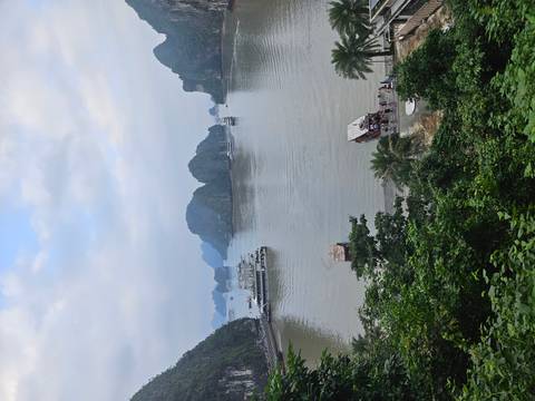 Ha Long Bay view with boats on the water.