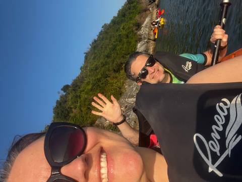 Two people kayaking on a sunny day.