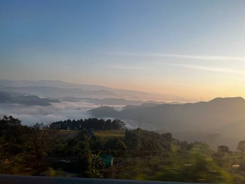 A breathtaking view of misty mountains at dawn.