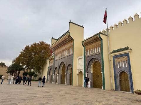Decorative gates with people standing nearby.