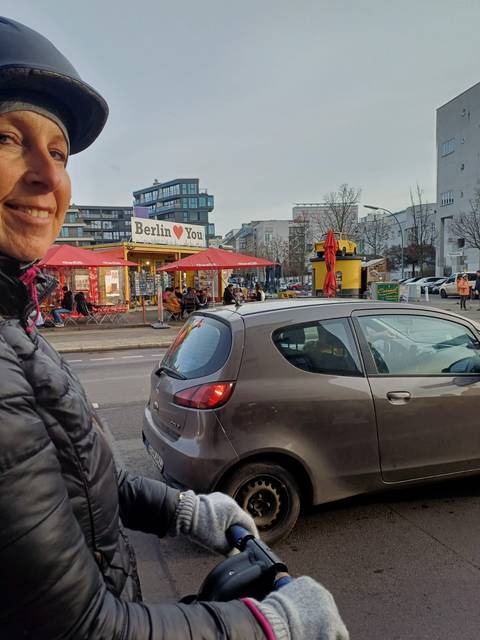 Street with cafe and cars in Berlin.