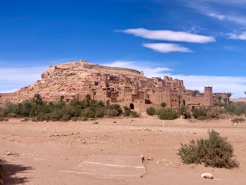Ancient fortified city built on a hill with clear sky.