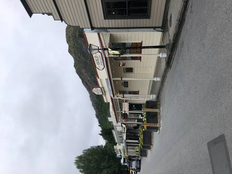 Quaint street with old-style architecture and shops.