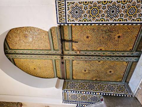 Ornate golden door with intricate designs.