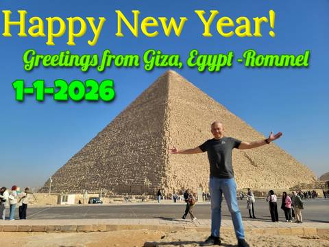 Person in front of the Great Pyramid of Giza with overlay text wishing a Happy New Year.