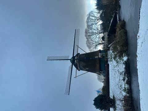 Windmill in a snowy landscape.