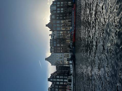 Canal lined with traditional buildings at dusk.