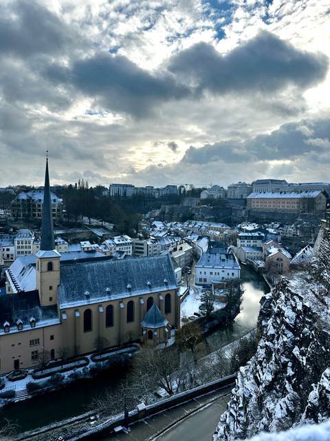 Snow-covered town observed from a high viewpoint.