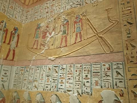 Ancient Egyptian hieroglyphics on a tomb wall.