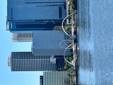 Cityscape with a waterfront view of modern skyscrapers.