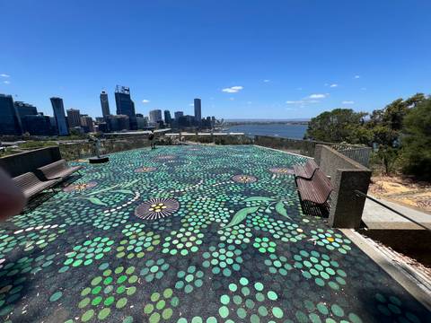 Scenic city view from an overlook with painted ground.