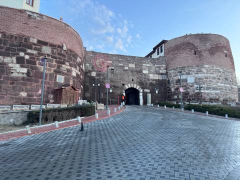 Ancient fortified gate with stone path.