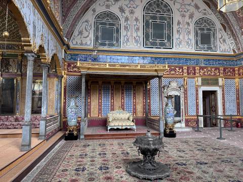 Opulent interior room with ornate decorations.