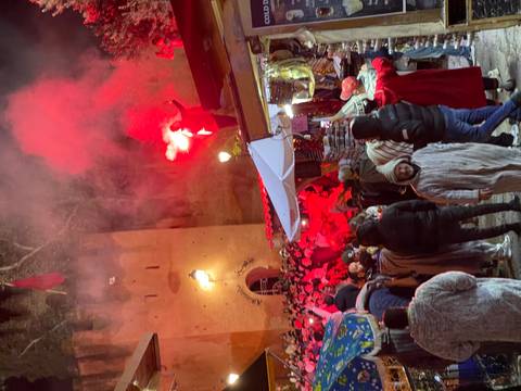 Crowd gathering for a bright and lively festival.