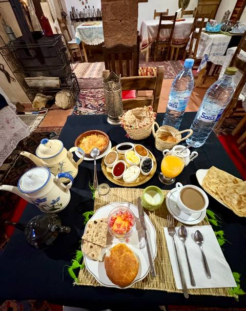 Traditional Moroccan breakfast setup with various dishes.