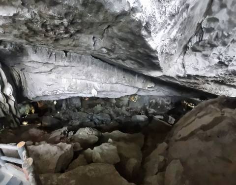 Cave interior with rock formations.