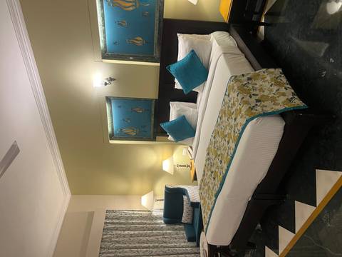 Elegant hotel room with tasteful decor and lighting.