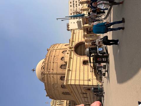 Visitors stand outside a domed Coptic church in Cairo’s old quarter