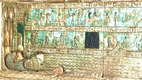 Turquoise-toned relief depicting boats and celestial motifs, likely on temple ceiling panel.