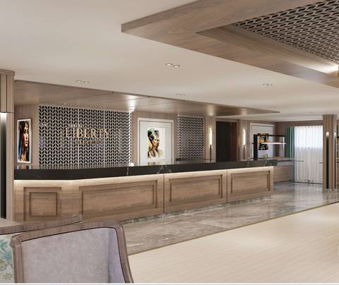 Modern hotel reception area with wood paneling, marble floors and stylish artwork