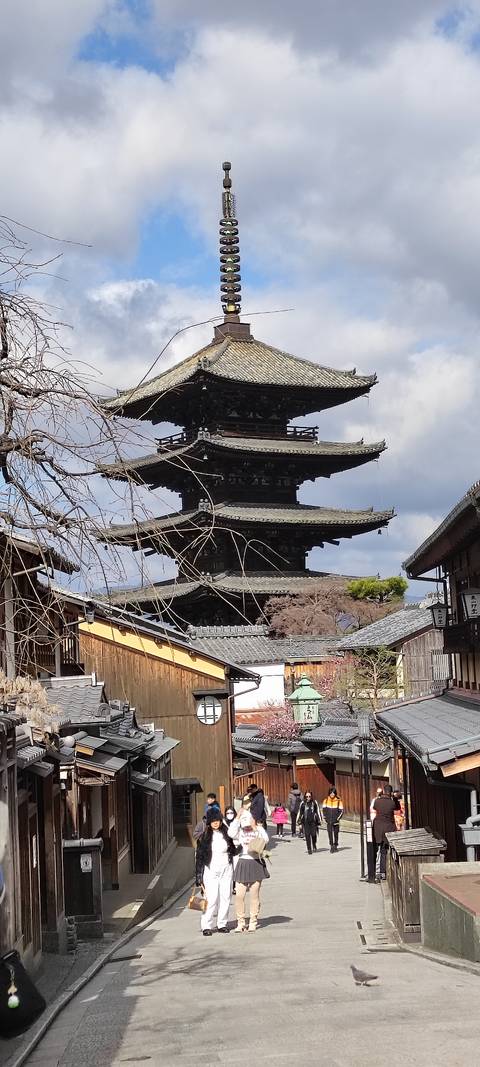 Historic five-story Yasaka Pagoda rising above traditional wooden streets in Kyoto.