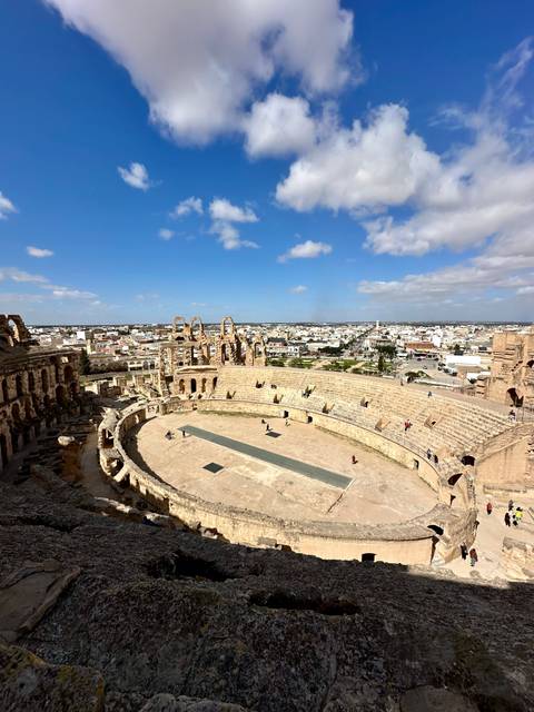 High vantage view over the vast Roman amphitheatre of El Jem with the town beyond.