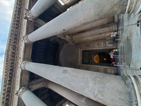 Visitors file into the mighty columns and bronze-roofed entrance of Rome's Pantheon.
