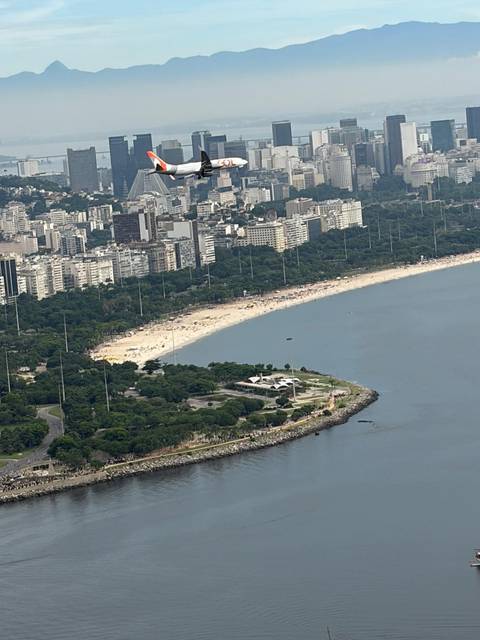 View over Flamengo Beach and urban coastline with city high-rises beyond.