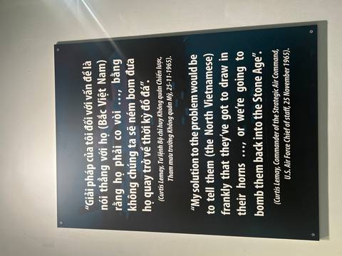 Museum wall panel displaying a bilingual quotation about the Vietnam War.